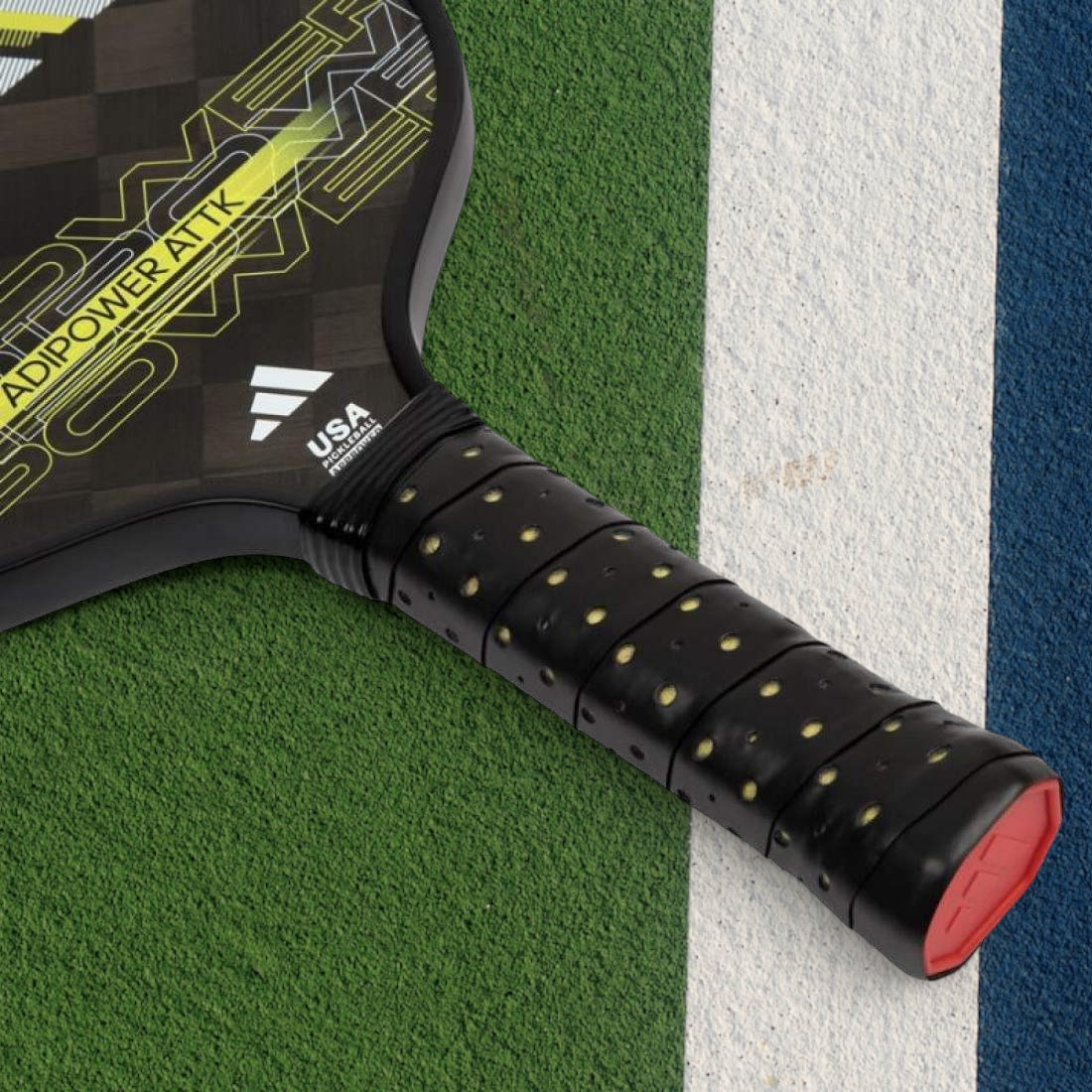 padelpickleball.store adidas Adipower Attk pickleball paddle with 24K carbon fiber and yellow accents on a court