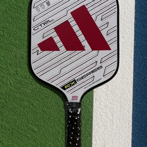 padelpickleball.store adidas RX Series CTRL pickleball paddle in white with red branding on a court surface